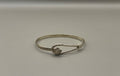 Unknown silver bangle with floral detail