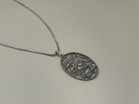Piet Hein pendant with silver chain