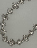 Silver necklace with floral design
