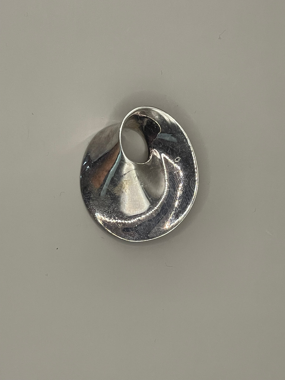 Georg Jensen Möbius brooch – designed by Vivianna Torun Bülow-Hübe