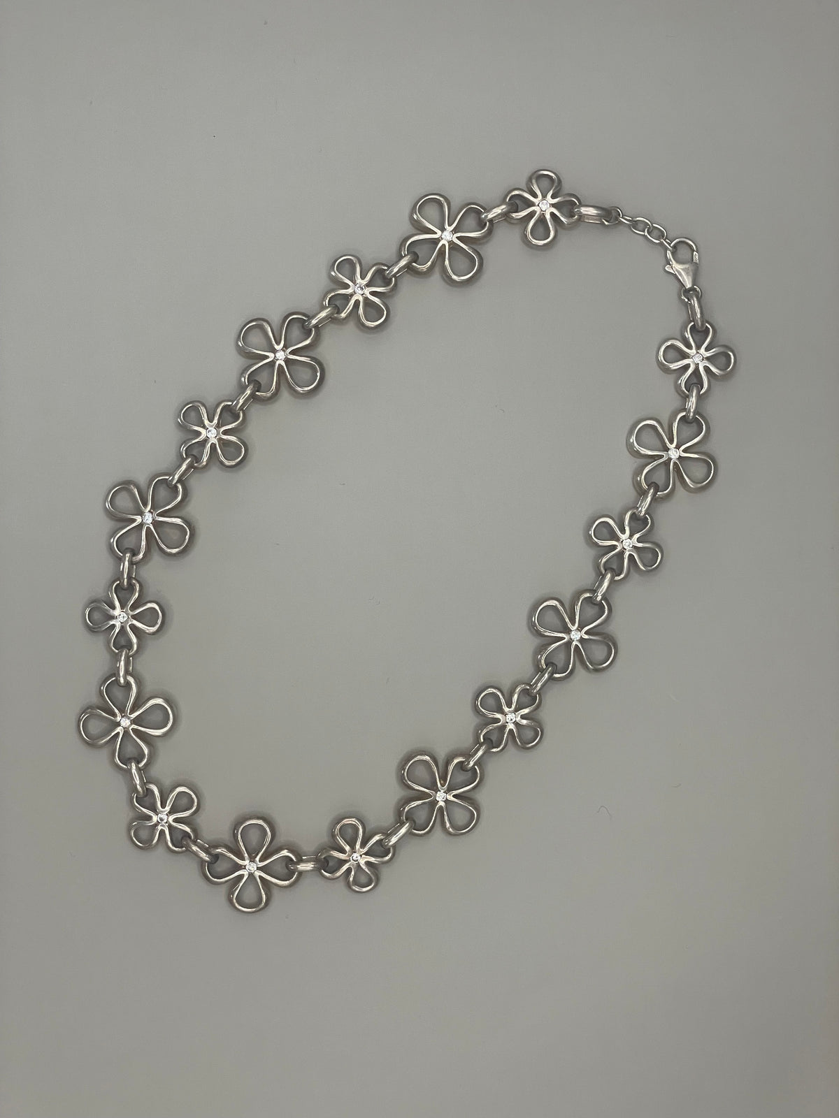 Silver necklace with floral design