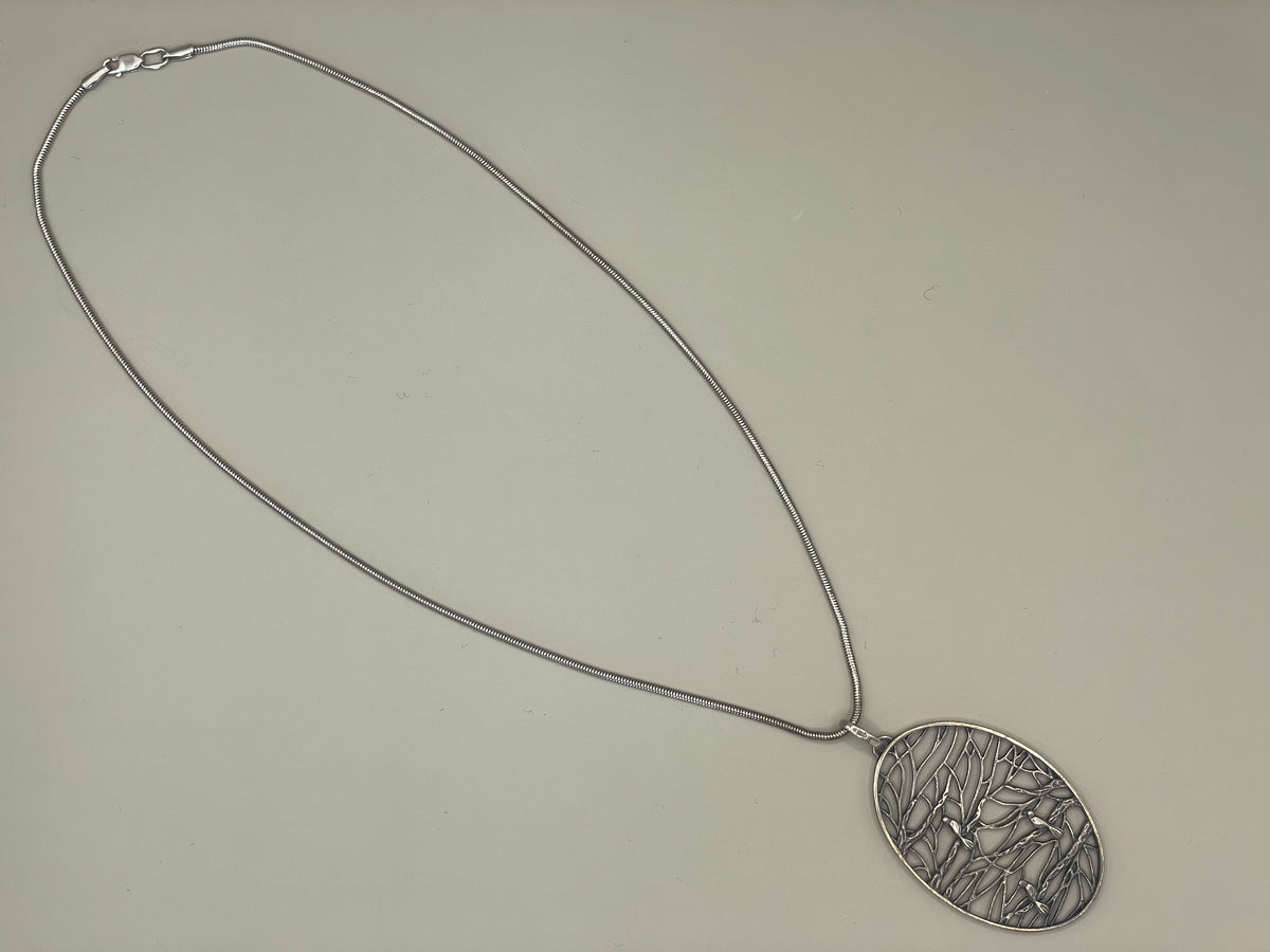 Piet Hein pendant with silver chain